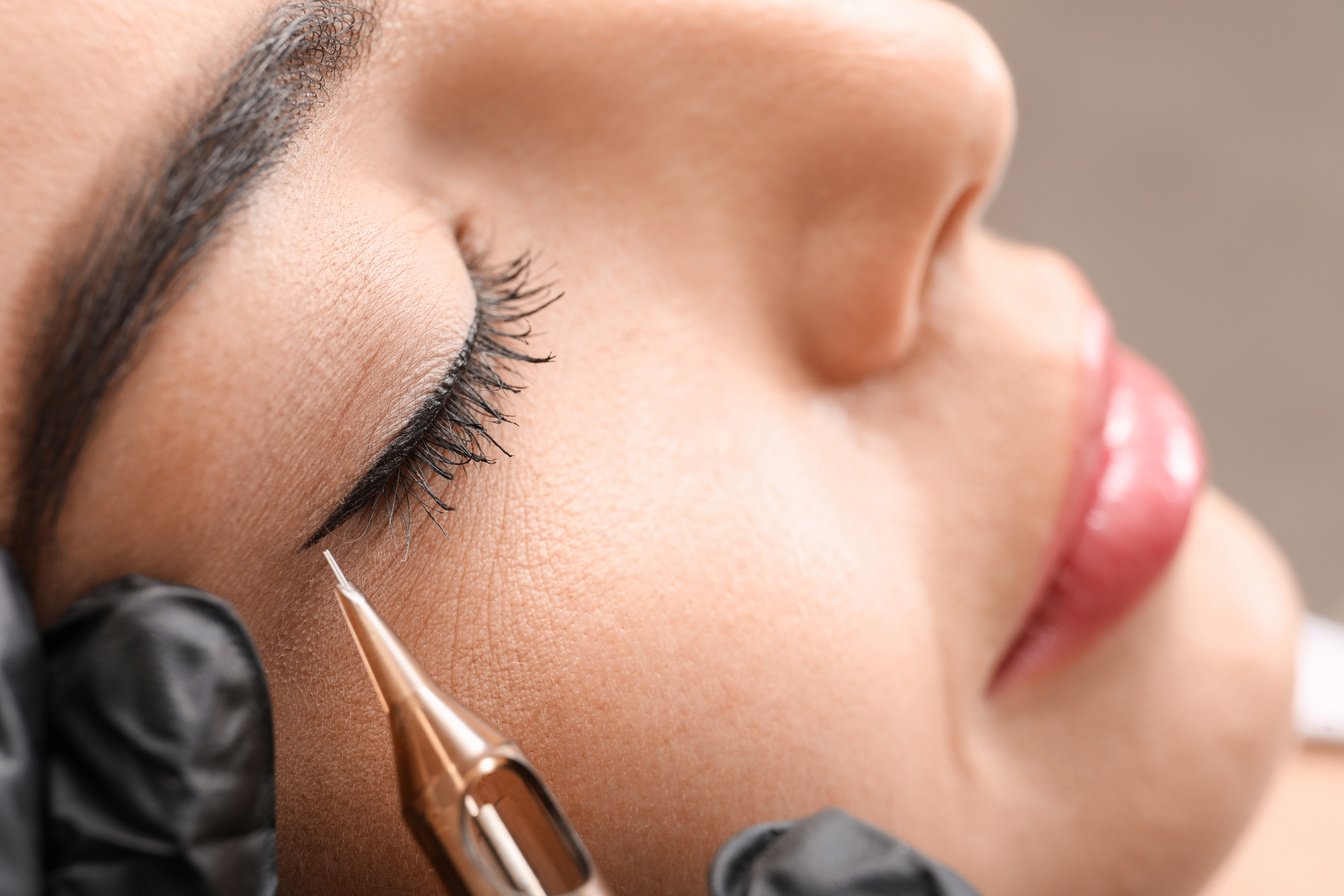 Young Woman Undergoing Procedure of Permanent Eye Makeup in Tatt